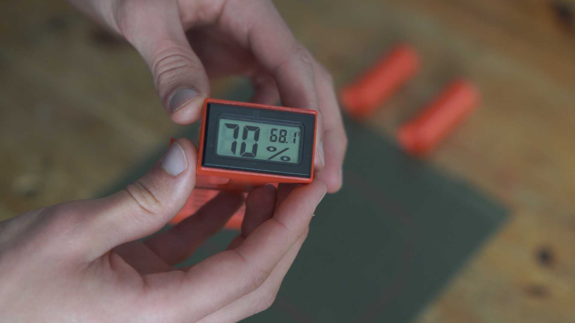 Clicking the hygrometer into the 3D-printed base mount