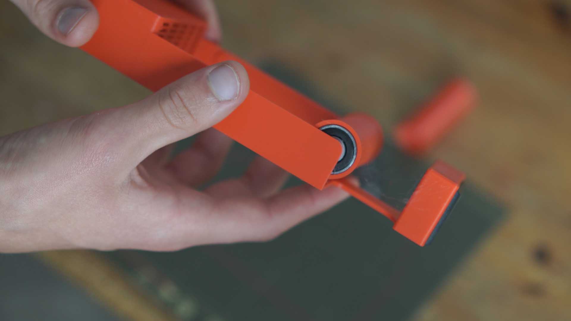 Inserting 608 bearings into the spool rollers and snapping onto base pegs